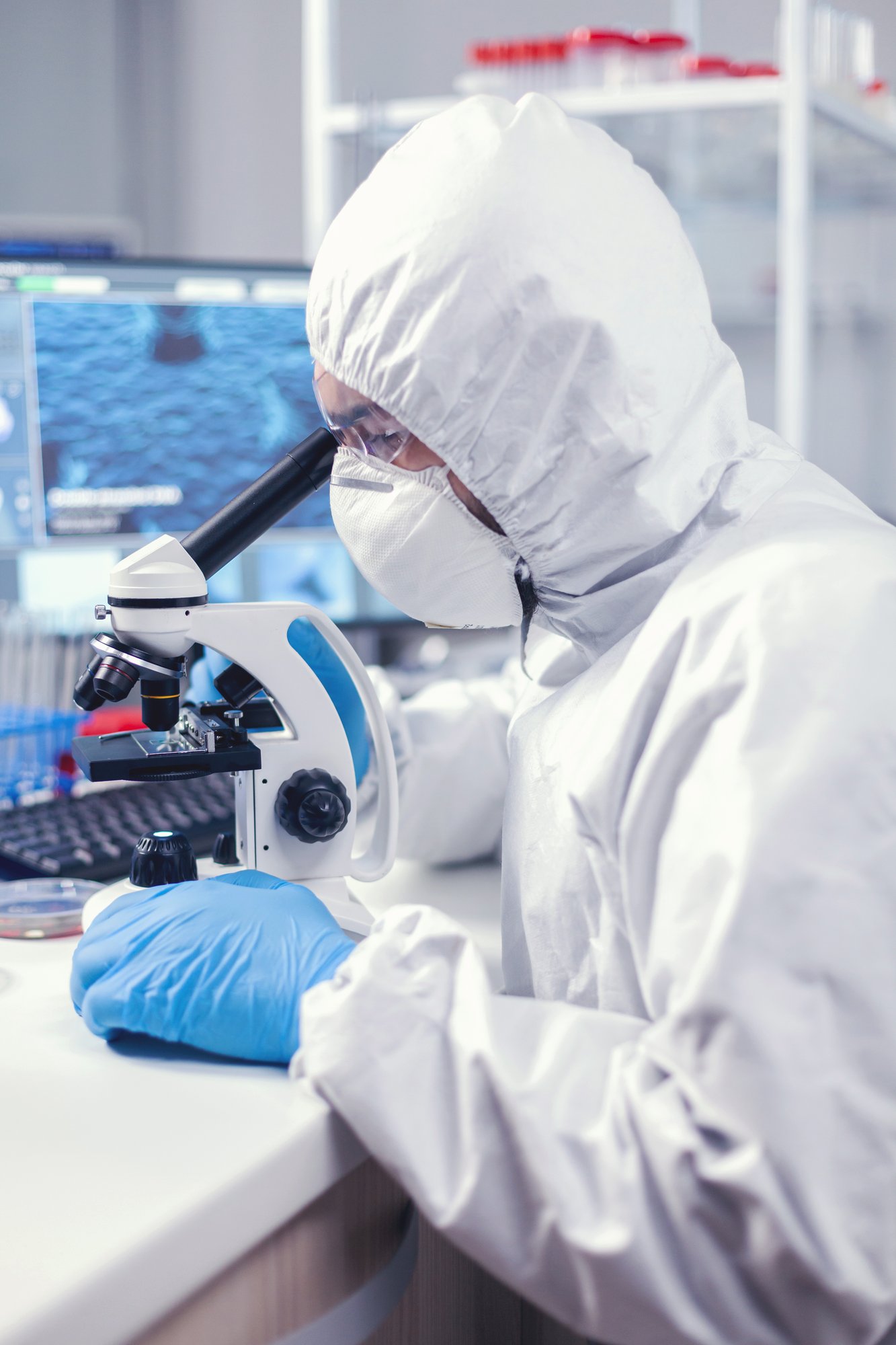 medic-time-global-pandemic-working-microscope-dressed-ppe-suit
